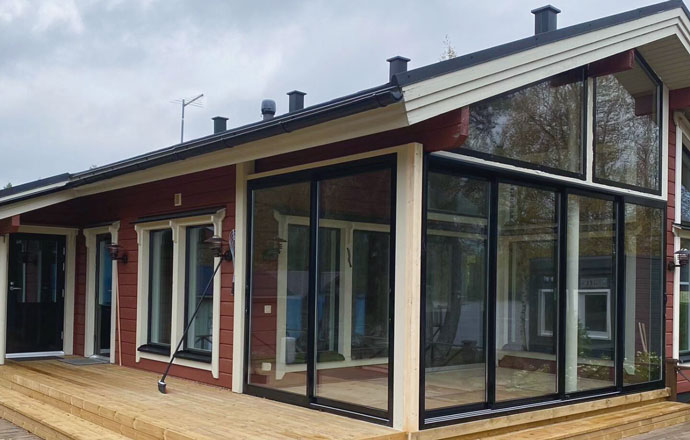 Windows from Prodeco installed at a red summer house